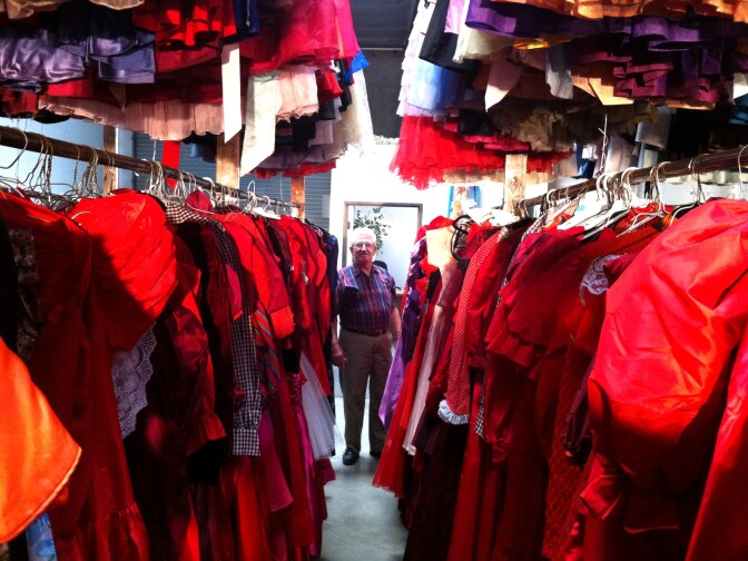 Paul Brockmann among just a few of the 55,000 dresses he's collected over 50 years. He loves the sound of taffeta. 