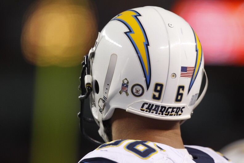 To commemorate Salute to Service month, Denver Broncos defensive tackle Mitch Unrein (96) wears an NFL Salute to Service logo on his helmet during an NFL football game against the Denver Broncos, Sunday, Nov. 18, 2012, in Denver. (AP Photo/David Zalubowski)
