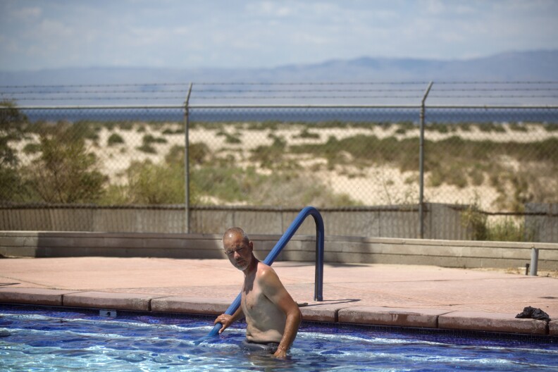 Randy Brown goes for a swim at Vista Del Mar Clubhouse while taking a break during his six-day walk around the Salton Sea on Friday, June 12, 2015. Brown made scouting missions to the sea leading up to his walk.