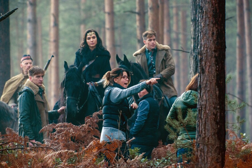Actors Gal Gadot and Chris Pine with director Patty Jenkins and extras on the set of "Wonder Woman."