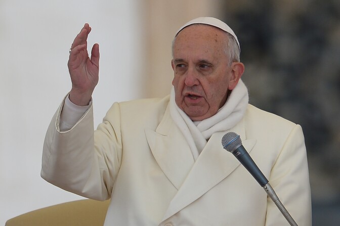 Pope Francis blesses the crowd during his general audience at St Peter's square on November 27, 2013 at the Vatican.