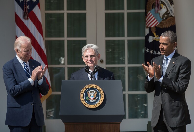Judge Merrick Garland (C) speaks after US President Barack Obama, with Vice President Joe Biden (L), announced Garland's nomination to the US Supreme Court, in the Rose Garden at the White House in Washington, DC, on March 16, 2016.
