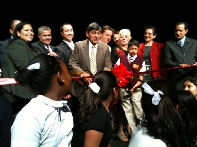Julian Nava cuts the ribbon on an LAUSD middle school recently given his name.