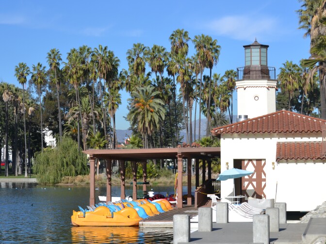 Paddle boats sit in the water next to Echo Park's historic boathouse. The boathouse was restored and reopened as part of the park's 2-year revitalization project.