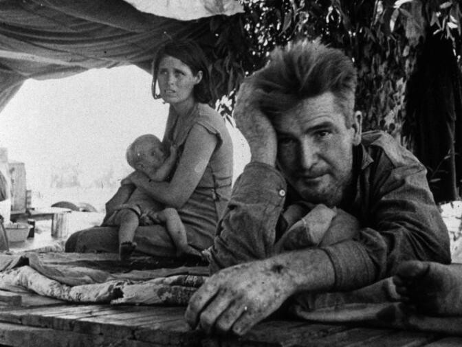 A family of migrant workers flees from the drought in Oklahoma camp by the roadside in Blythe, California, during The Great Depression.