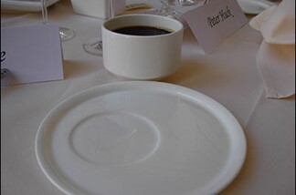 The place setting at the Getty's annual media lunch demonstrates how the vaunted institution is saving money: they buy irregulars from the china store.