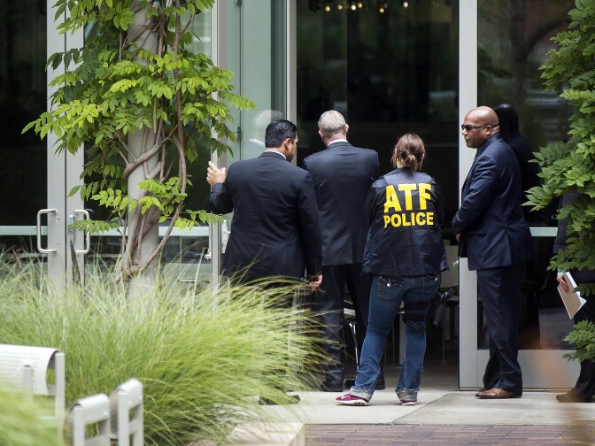Bureau of Alcohol, Tobacco, Firearms and Explosives agents help people shelter in place inside the Bomb Shelter, a campus eatery, on Wednesday, June 1, 2016 following a murder-suicide on the University of California, Los Angeles campus.