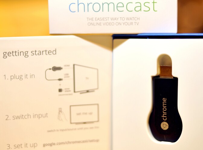 The new Google Chromecast is arranged on a table at a media event at Dogpatch Studios on July 24, 2013 in San Francisco, California. Google on Wednesday unveiled a slim, powerful new Nexus tablet computer and a thumb-drive sized device that lets popular mobile gadgets feed online content to television sets. 