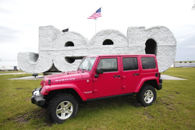 TOLEDO, OH - MAY 7:  A 2014 Jeep Wrangler sits in front of a Jeep sign at the Chrysler Toledo North Assembly Plant where Jeep Wranglers and Cherokees are assembled May 7, 2014 in Toledo, Ohio. Fiat Chrysler Automobiles announced it wants to turn Jeep into a global brand as part of an aggressive five-year plan. The automaker also plans on bringing back the Alfa Romeo to the U.S.  (Photo by Bill Pugliano/Getty Images)