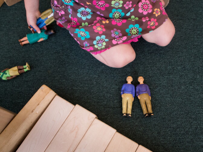 A preschool student at La Cañada plays with dolls on May 23rd, 2013.