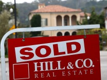  A sold sign is posted in front of a home for sale on July 30, 2013 in San Francisco, California. The report notes that people in California spend more of their income on housing than anywhere else in the country. 
