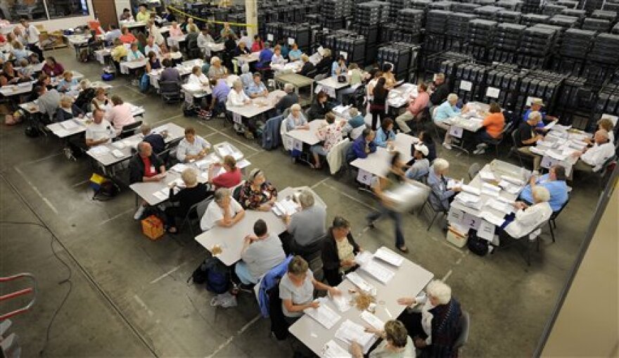 Workers sorts mailed in ballots at the County of Orange Registrar of Voters in Santa Ana, Calif., Tuesday, Oct. 28, 2008.