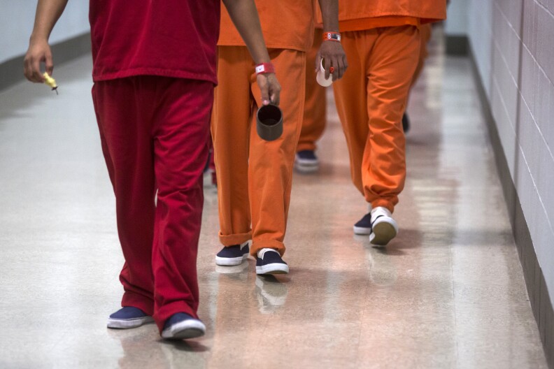 Detainees are taken back to their dorms after lunch at the U.S. Immigration and Customs Enforcement's Detention Facility in Adelanto on Friday, Sept. 2, 2016.