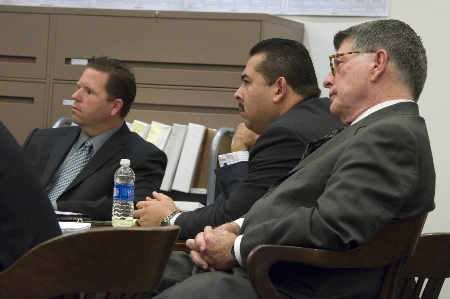 Former Fullerton police officers Jay Cicinelli, left, and Manuel Ramos listen with Ramos' defense attorney, John D. Barnett, right, as Orange County district attorney Tony Rackauckas delivers his rebuttal closing argument in the case against them stemming from the death of Kelly Thomas, a homeless man, who died after a violent 2011 confrontation with the [then] officers.

///ADDITIONAL INFO: SLUG: kellythomas0109 - 1/9/14  - PHOTO BY JOSHUA SUDOCK, ORANGE COUNTY REGISTER/POOL PHOTO -- Closing arguments concluded in the trial of two former Fullerton police officers, Manuel Ramos and Jay Cicinelli, in Santa Ana Thursday. The men are facing charges related to the death of Kelly Thomas, a homeless man, who died after a violent 2011 confrontation with the [then] officers.

Picture made at the Orange County Superior Court’s department-40 courtroom in Santa Ana Thursday, January 9, 2014.