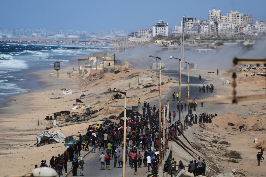 People gather near a beach.