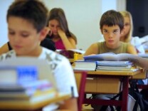 File photo: Pupils listen to their teacher in a classroom on the first day of the school year. 