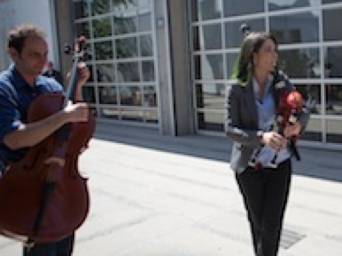 Musician Cristina Pato plays a Galician bagpipe as she leads students from their classrooms to a live performance at Inner City Arts.