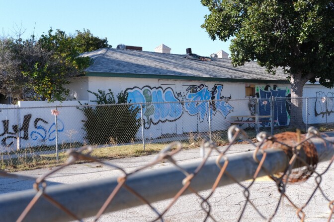 Graffiti covers a building on a site that no longer has a guaranteed pathway to becoming affordable housing under ED1.