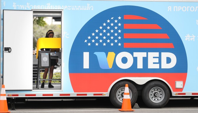 UNIVERSAL CITY, CALIFORNIA - FEBRUARY 27: A voter prepares her ballot during early voting for the California presidential primary election at a new L.A. County ‘Mobile Vote Center’ outside Universal Studios Hollywood on February 27, 2020 in Universal City, California. Los Angeles County and 14 other counties in California have transitioned from traditional polling places to ‘vote centers’ which allow residents the freedom to vote at any voting center in their county. California is one of 14 states participating in the Super Tuesday vote on March 3. (Photo by Mario Tama/Getty Images)