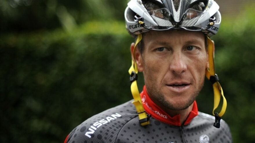 Lance Armstrong arrives at a training session during a rest day of the 2010 Tour de France.