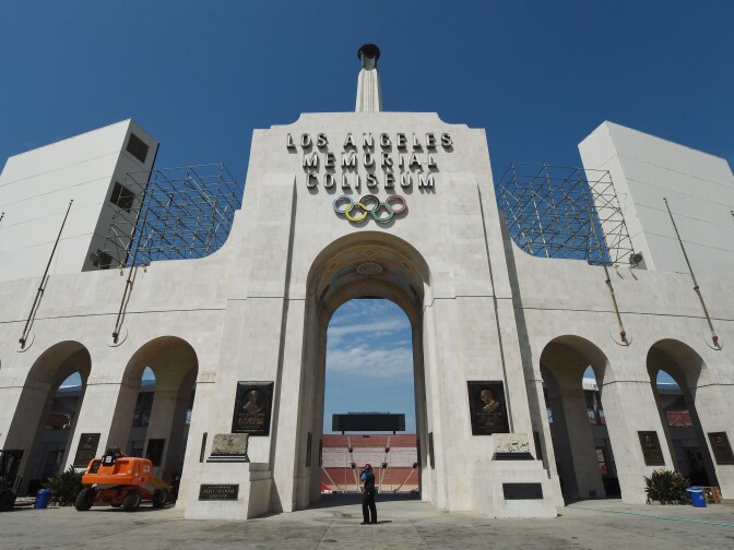 The Los Angeles Memorial Coliseum, venue for two previous Olympic Games, is seen in this on August 26, 2015 in Los Angeles, California. The Coliseum would be renovated and used as the main stadium if the city bids for the 2024 Summer Olympics. The Los Angeles city council is reviewing a $4.1 billion bid proposal for the 2024 Summer Olympics that backers say could produce a surplus of $161 million if the city is awarded a third Summer Games. A 218-page bid book made public on August 25 shows plans for a Los Angeles Games rely on private-sector partners to pay more than $1.7 billion in venue costs and includes revenue projections such as $4.8 billion from ticket sales, broadcast rights and corporate sponsorships.       AFP PHOTO / MARK RALSTON        (Photo credit should read MARK RALSTON/AFP/Getty Images)