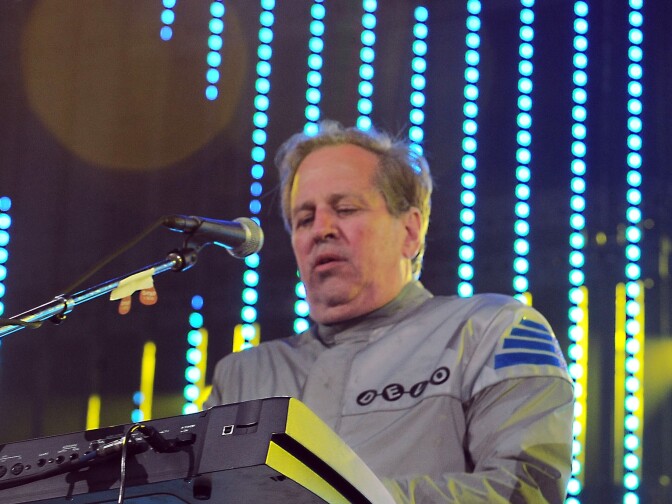 This June 5, 2010 file photo shows Bob Casale performing live at The 2010 KROQ Weenie Roast in Irvine, Calif. Casale, of the band Devo best known for the 1980s hit “Whip It,” died Monday, Feb. 17, 2014, from conditions that led to heart failure, his brother and band member Gerald Casale said Tuesday. He was 61. Devo founder Gerald says in a statement his younger brother’s death was “sudden” and “a total shock.”  
