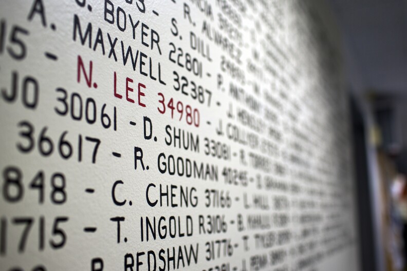 Officer Nicholas Lee's name is marked in red on a mural inside LAPD's Hollywood Division. Lee was killed when his patrol car collided with a commercial vehicle on March 7.