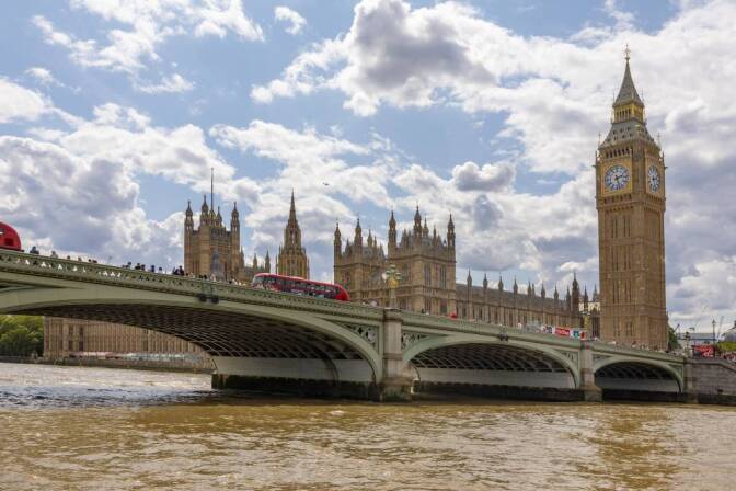 Big Ben and the Houses of Parliament are seen across the Thames River.