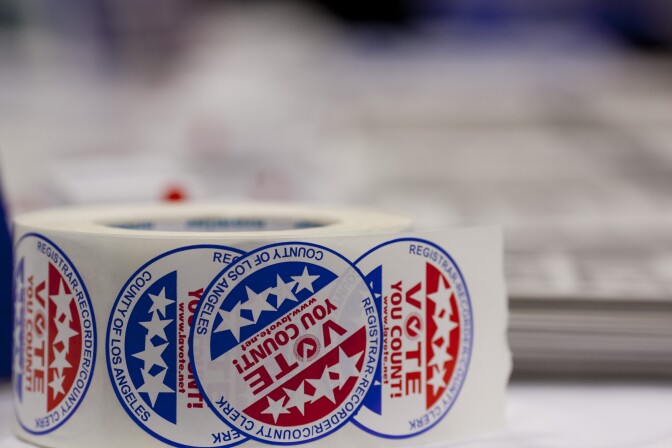 Volunteers gave about stickers to newly naturalized American citizens after they registered to vote.