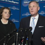 Chairman of the US Senate Select Committee on Intelligence Richard Burr (R), R-North Carolina, speaks with Vice Chair Senator Dianne Feinstein (L), D-California.