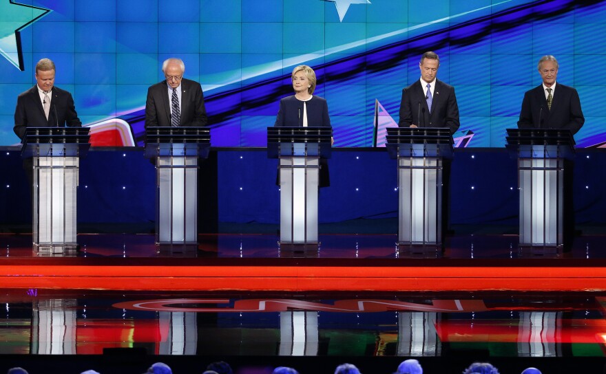 Democratic presidential candidates from left, former Virginia Sen. Jim Webb, Sen. Bernie Sanders, of Vermont, Hillary Rodham Clinton, former Maryland Gov. Martin O'Malley, and former Rhode Island Gov. Lincoln Chafee take the stage before the CNN Democratic presidential debate Tuesday, Oct. 13, 2015, in Las Vegas. (AP Photo/John Locher)