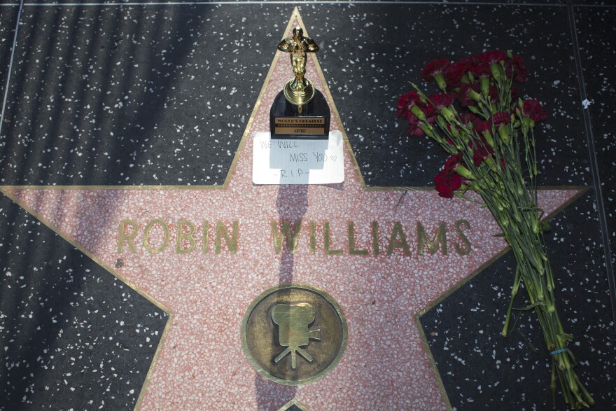 Items are left in memory of Robin Williams on his star along Hollywood Boulevard.