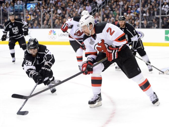 Jarret Stoll #28 of the Los Angeles Kings stick checks Marek Zidlicky #2 of the New Jersey Devils in the second period in Game Six of the 2012 Stanley Cup Final at Staples Center on June 11, 2012 in Los Angeles, California. 