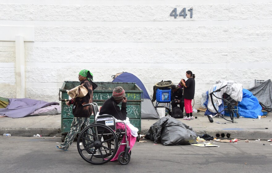Homeless women prepare for another day and night on the street near Skid Row in Los Angeles, California on May 12, 2015. A report released by the Los Angeles Homeless Authority on May 11 showed a 12% increase in the homeless population in both Los Angeles city and county, which according to the report have been driven by soaring rents, low wages and stubbornly high unemployment. One of the most striking findings from the biennial figures released saw the number of makeshift encampments, tents and vehicles occupied by the homeless increased 85%.  AFP PHOTO / FREDERIC J. BROWN        (Photo credit should read FREDERIC J. BROWN/AFP/Getty Images)
