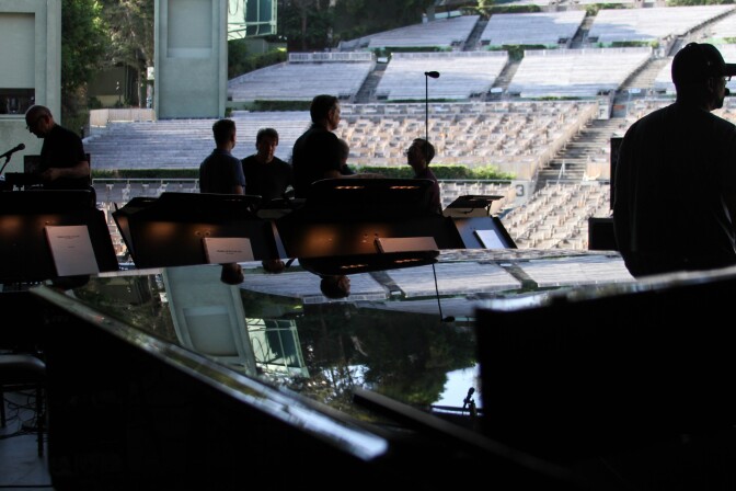 Sound engineers and performers prepare for rehearsal at the Hollywood Bowl on Aug. 4, 2017.