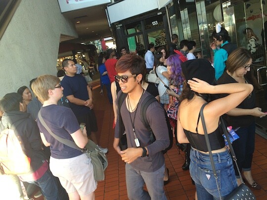 Crowds of people wait outside LA's first cat cafe, the Catfé
