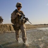 Hospital Corpsman Shannon Crowley, 22, US Navy Sailor, patrols along with male marines November 17, 2010 in Musa Qala, Afghanistan.