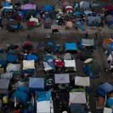 File: A large homeless encampment is formed in the Santa Ana Civic Center on Wednesday, Oct. 11, 2017, in Santa Ana.