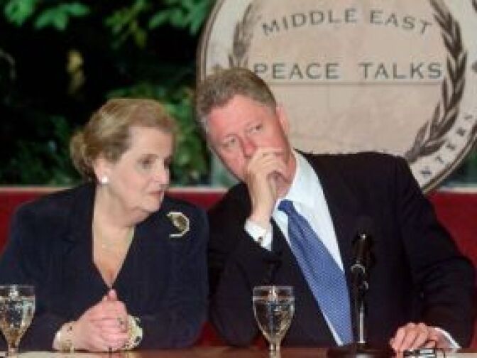 Former Secretary of State Madeleine Albright talks with then-President Bill Clinton on the Wye River Plantation hoping to wrap up an agreement on a 13 percent Israeli withdrawal from the West Bank paving the way to a final peace settlement.