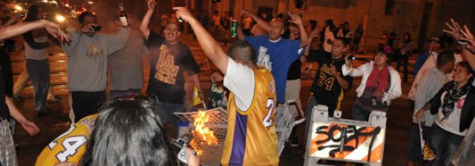 Fans cheer in the middle of the intersection at Figueroa Blvd and 11th St. in Downtown Los Angeles after a Laker victory in the NBA Finals on June 17, 2010