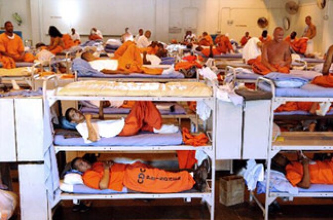 California prisoners in a crowded gymnasium.