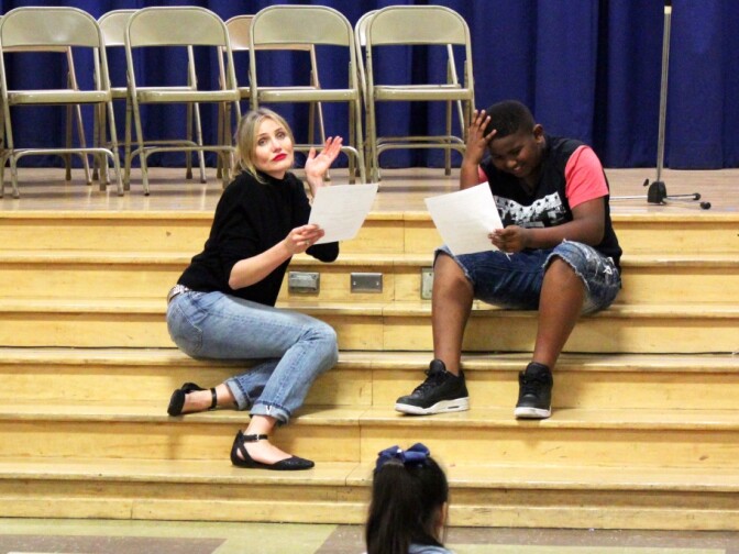 Actress Cameron Diaz, the school's celebrity mentor through Turnaround Arts: California, reads a scene from Shrek with fifth grader Kirk Clarke in February.