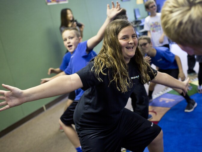Fourth grader Ava Garaway takes part in the game "Lemonade Crunchy Ice" during a music class on Tuesday, March 31, 2015 at Meadows Arts and Technology Elementary School in Thousand Oaks. A goal of the music program is for students to have the confidence and skills to pursue musical activities like band when they reach middle school.