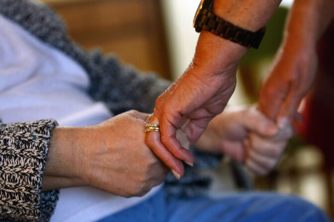 DENVER - NOVEMBER 04:  Registered nurse Susan Eager checks the strength of a patient's grip while performing a home visit on November 4, 2009 in Denver, Colorado. Eager works for the Dominican Sisters Home Health Agency, a non-profit that performs some 25,000 home visits each year in the Denver area. It provides free home nursing care to patients with chronic diseases, helps them to better manage their disabling illnesses and provides custodial services with the aim of keeping patients in their homes and out of more expensive nursing home care.  (Photo by John Moore/Getty Images) *** Local Caption *** Susan Eager