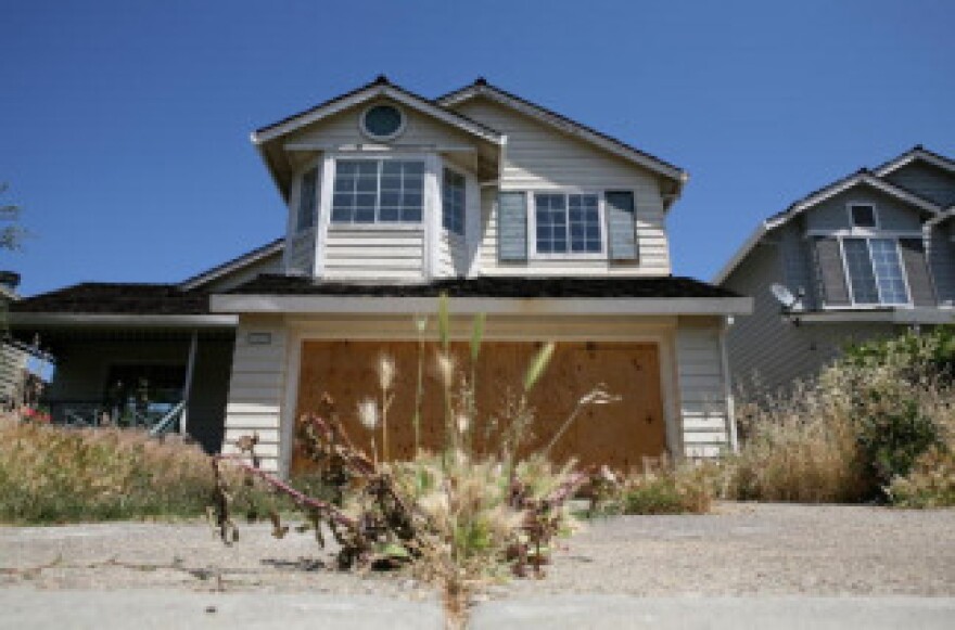 Weeds grow in the driveway of a foreclosed home on May 7, 2009 in Antioch, California.