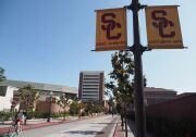 A young man rides a bicycle on the campus of the University of Southern California (USC) in Los Angeles, California on May 17, 2018. - USC was in turmoil as it was accused of being too slow to act on accusations of abusive sexual practises by Dr. George Tyndall. A gynaecologist who saw student patients at the Engemann Student Health Center.  USC has already received more than 85 current and former student testimonies accusing Tyndall of abuse during examinations. (Photo by Robyn Beck / AFP)        (Photo credit should read ROBYN BECK/AFP/Getty Images)