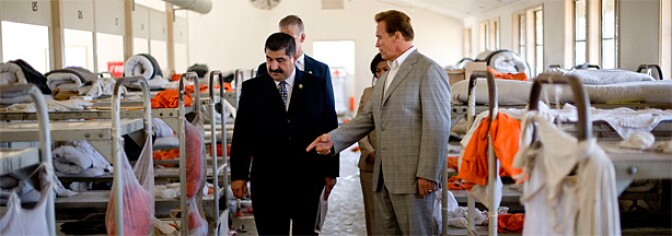California Governor Arnold Schwarzenegger (R) tours the California Institution for Men prison with Warden Aref Fakhoury (L) on August 19, 2009 in Chino, California.