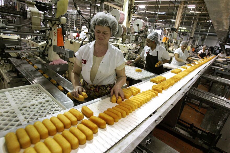 Workers prepare Hostess Twinkies for packaging at the Interstate Bakeries Corporation facility. 