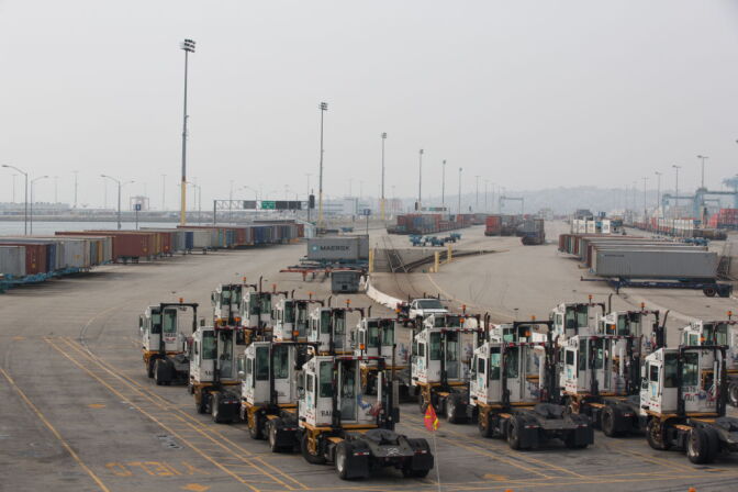 Trucks remain idle at the APM Terminals at the Port of Los Angeles as a result of the clerical workers strike.