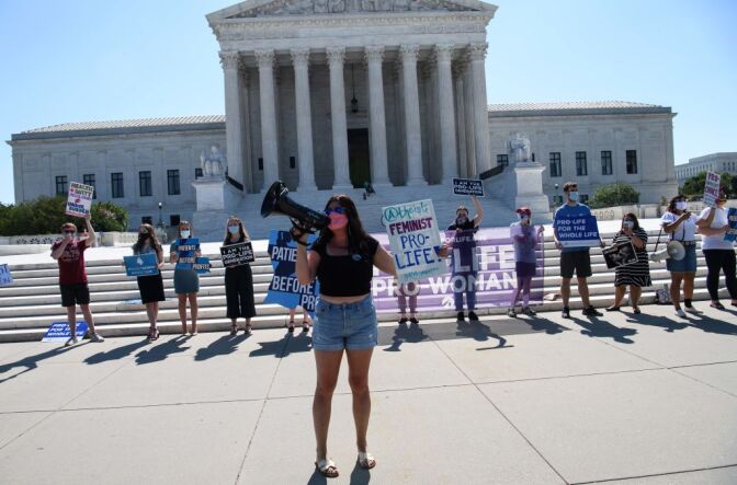 Anti-abortion activists demonstrate in front of the US Supreme Court in Washington, DC, on June 29, 2020. - The court rejected Louisiana's restrictions on abortion in a key victory for abortion rights activists. The conservative-leaning court split 5-4 on the decision overruling a state law that requires doctors who perform abortions to have admitting privileges at a nearby hospital. (Photo by NICHOLAS KAMM / AFP) (Photo by NICHOLAS KAMM/AFP via Getty Images)